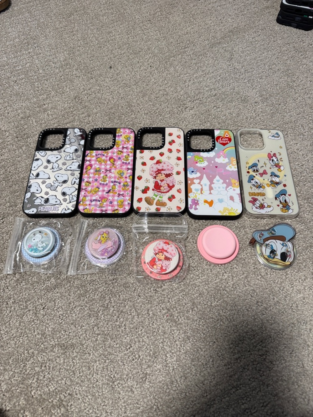 16 pro max set of 5 cases with magnetic popsockets to match.